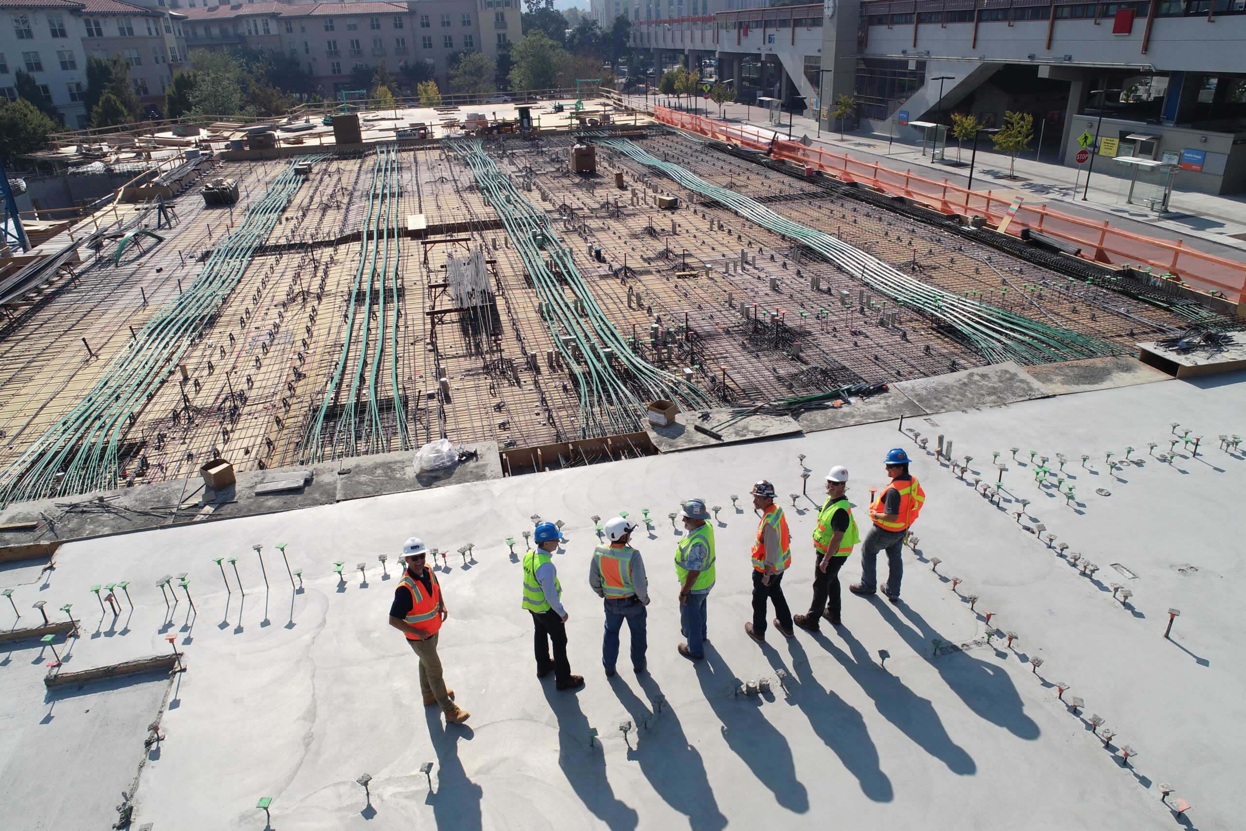 people looking out over construction site